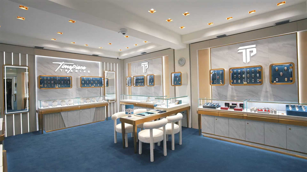 Timepiece Trading’s Miami showroom with branded watch displays, glass counters and a consultation table